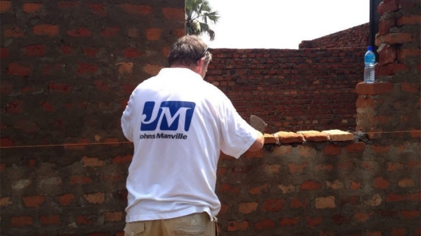 Jeff laying bricks in Uganda proving how a career can empower giving back Jeff laying bricks in Uganda proving how a career can empower giving back