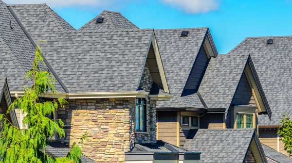 A residential home protected by fiberglass reinforced roofing shingles designed for long‑term wind, hail, fire, and weather performance. A residential home protected by fiberglass reinforced roofing shingles designed for long‑term wind, hail, fire, and weather performance.